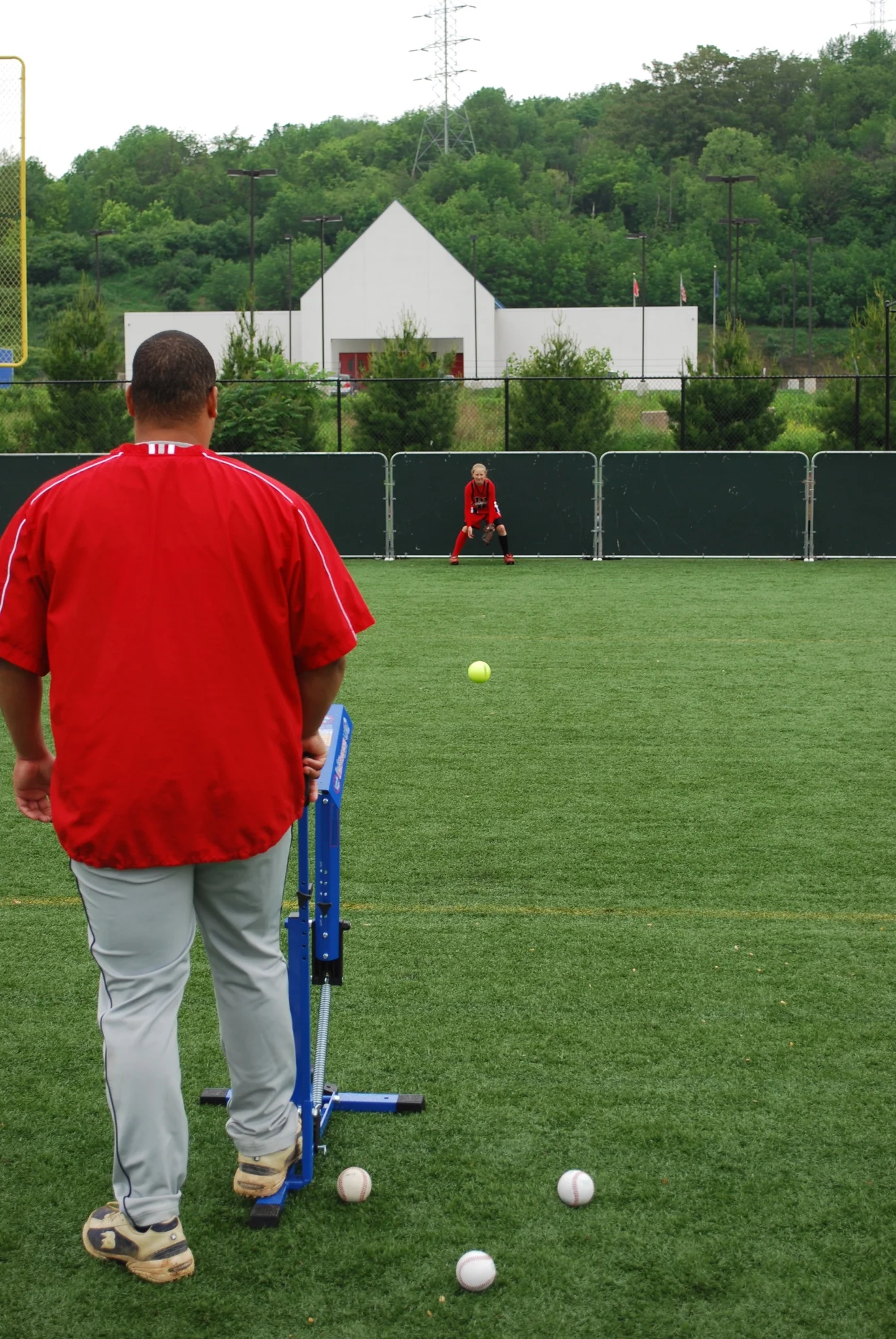 Louisville Slugger Blue Flame Pitching Machine – Manual Baseball & Softball Trainer, Throws Up to 60 MPH, Youth & Adult Practice Tool